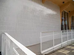 A new section has been added to Katoba primary school near Brussels, with a combination of concrete, wood, glazing and a ceramic tile facade