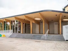 A new section has been added to Katoba primary school near Brussels, with a combination of concrete, wood, glazing and a ceramic tile facade