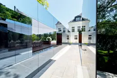 Mirrored StoVentec Glass used on a contemporary pool house in Vienna, Austria