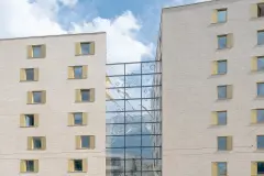 The glazed atria spaces between the buildings of the Stadt Carre complex in Innsbruck beautifully frame mountain views in the background.