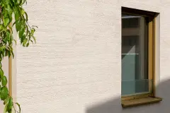 The textured render facade on the internal courtyard-facing walls mimic the pattern of the brickwork on the outer walls, in a matching colour.