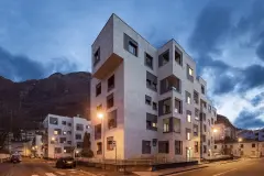 A view of the renovated buildings on Via Aslago in the evening light