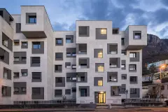 A view of the renovated buildings on Via Aslago in the evening light