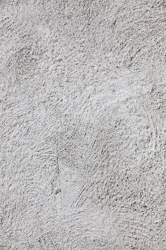 Surface detail of grey StoSignature render in its freeform brushed pattern