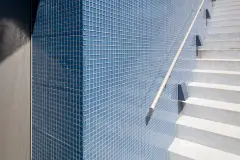 Villa Mimi at Lake Millstatt cantilevers over a hillside, finished with blue glass mosaic tiles